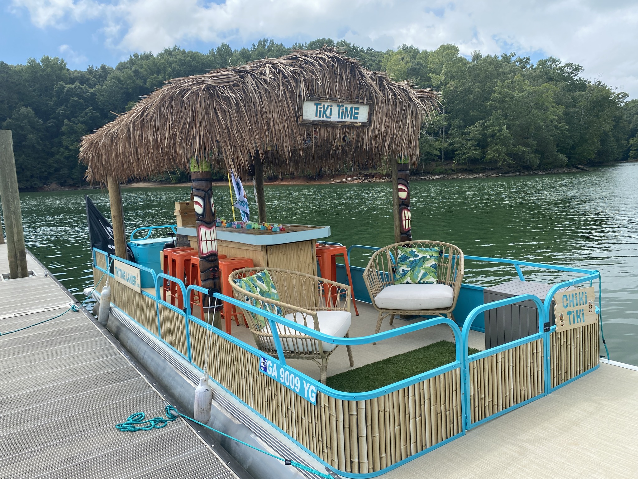 A tiki boat on the water during the Lake Lanier boat rental season