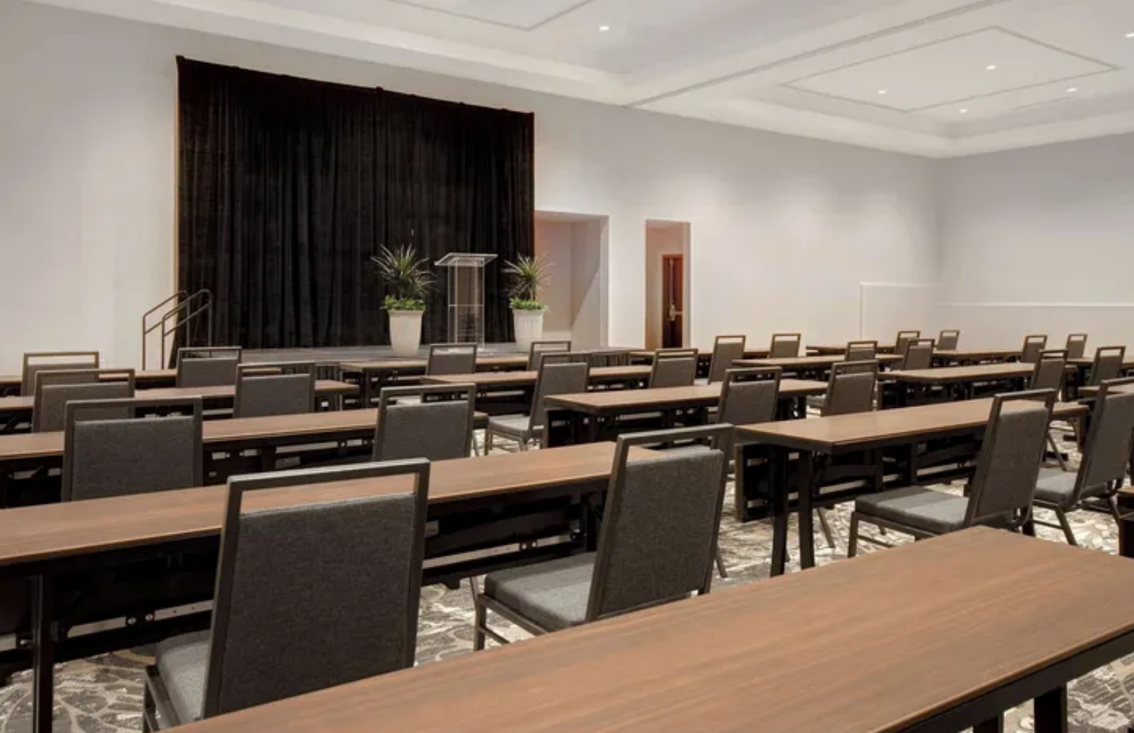 A classroom setup in a meeting room at Embassy Suites by Hilton Alpharetta Halcyon