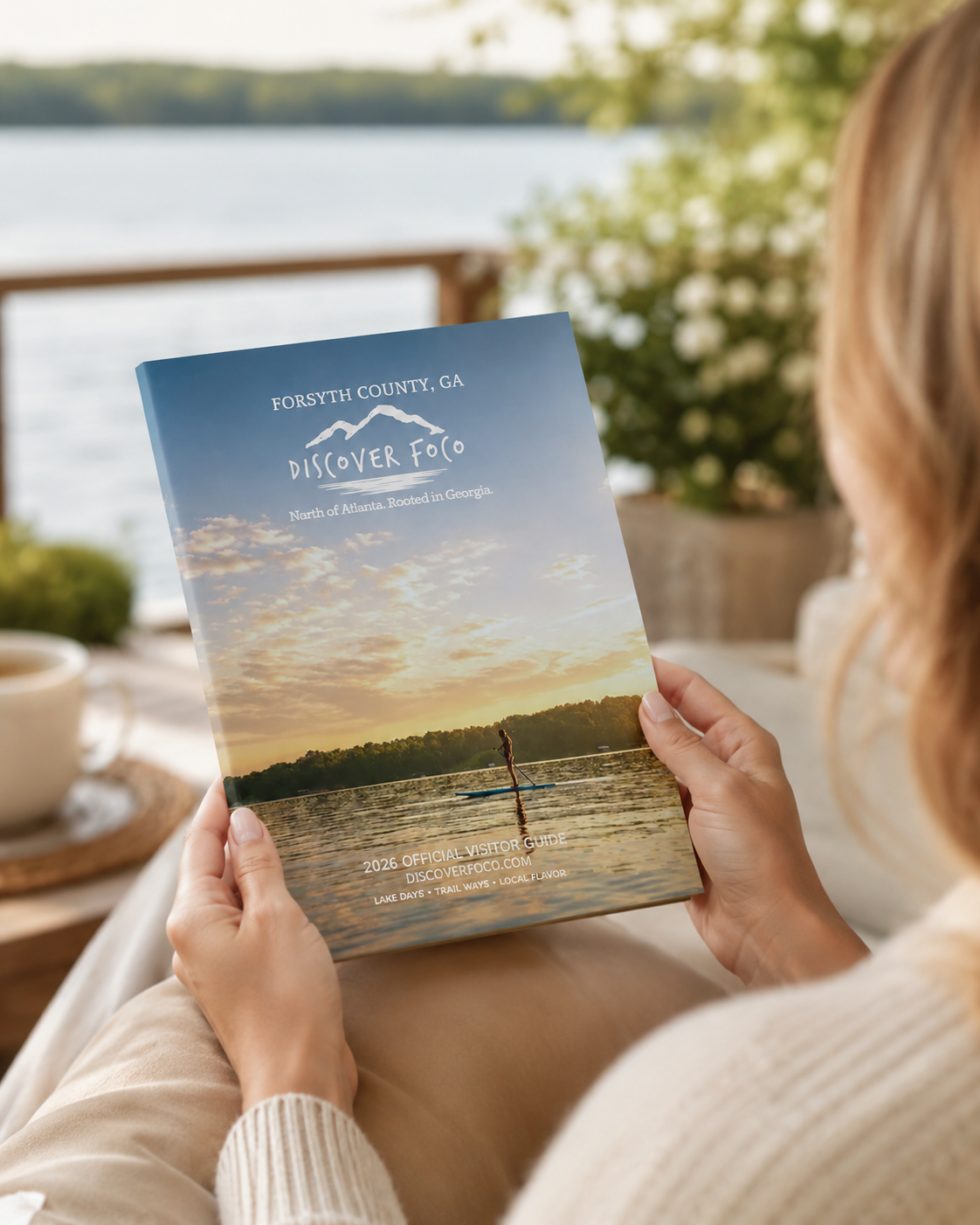 The Forsyth County visitor guide, open to a Lake Lanier sunset