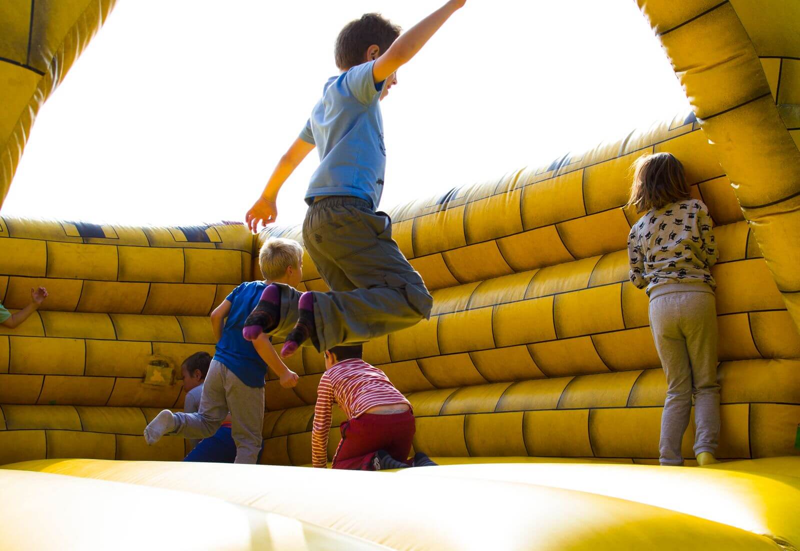 Children playing on an inflatable bounce house