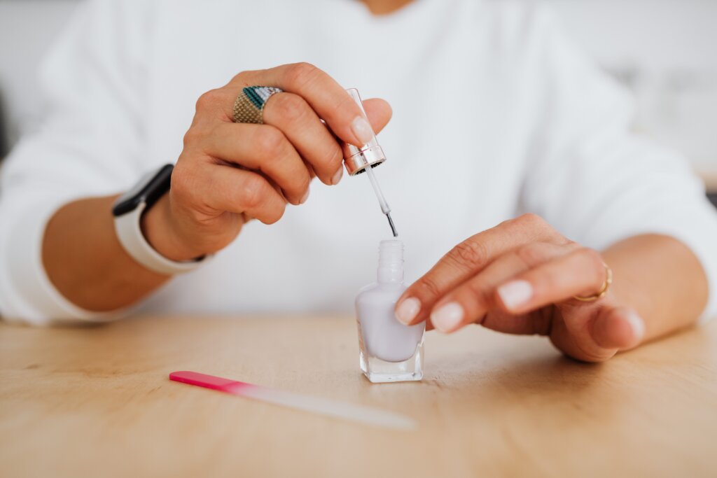 Stock photo: applying nail polish. Not an image of this business.