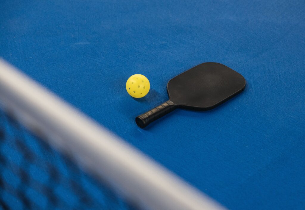 Stock photo: pickleball paddles and ball. Not an image of this business.